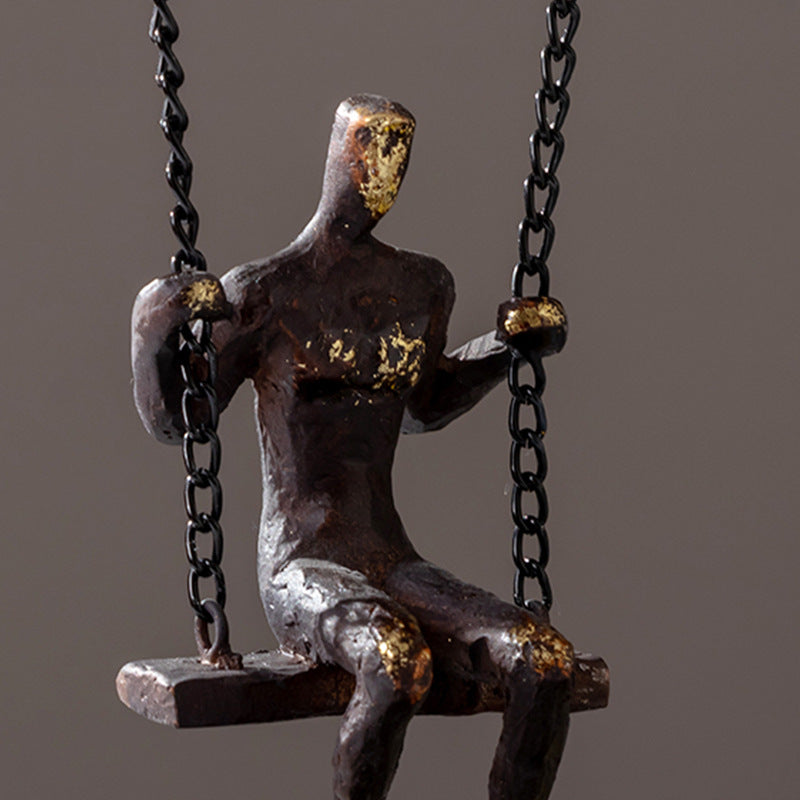 Man on a Swing Sculpture