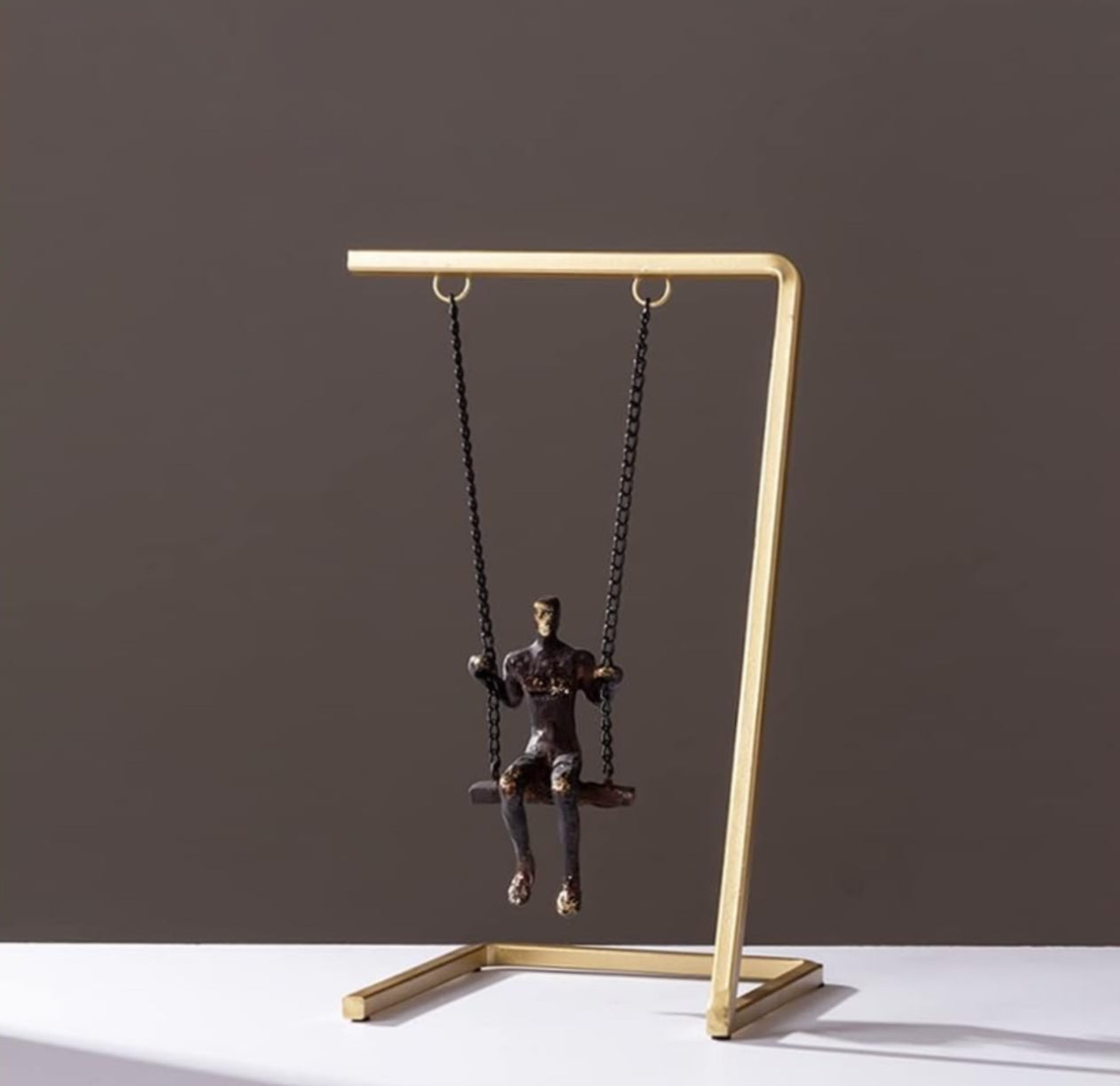 Man on a Swing Sculpture