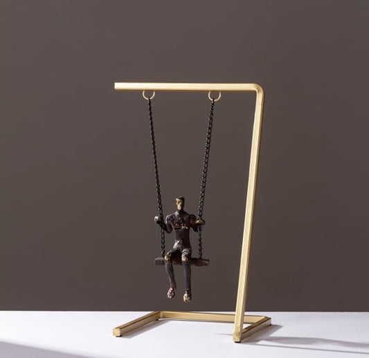 Man on a Swing Sculpture